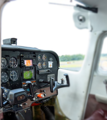 A cockpit of an airplane with a lot of buttons on it