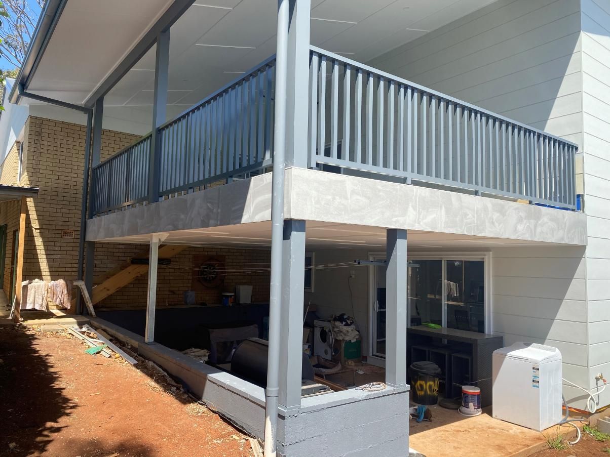 A House With a Balcony and a Fence is Being Built — Lifestyle Aluminium Fabrication In Fairy Meadow, NSW