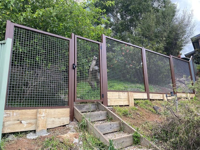 A Fence With Stairs Leading Up To It And Trees In The Background — Lifestyle Aluminium Fabrication In Albion Park Rail, NSW