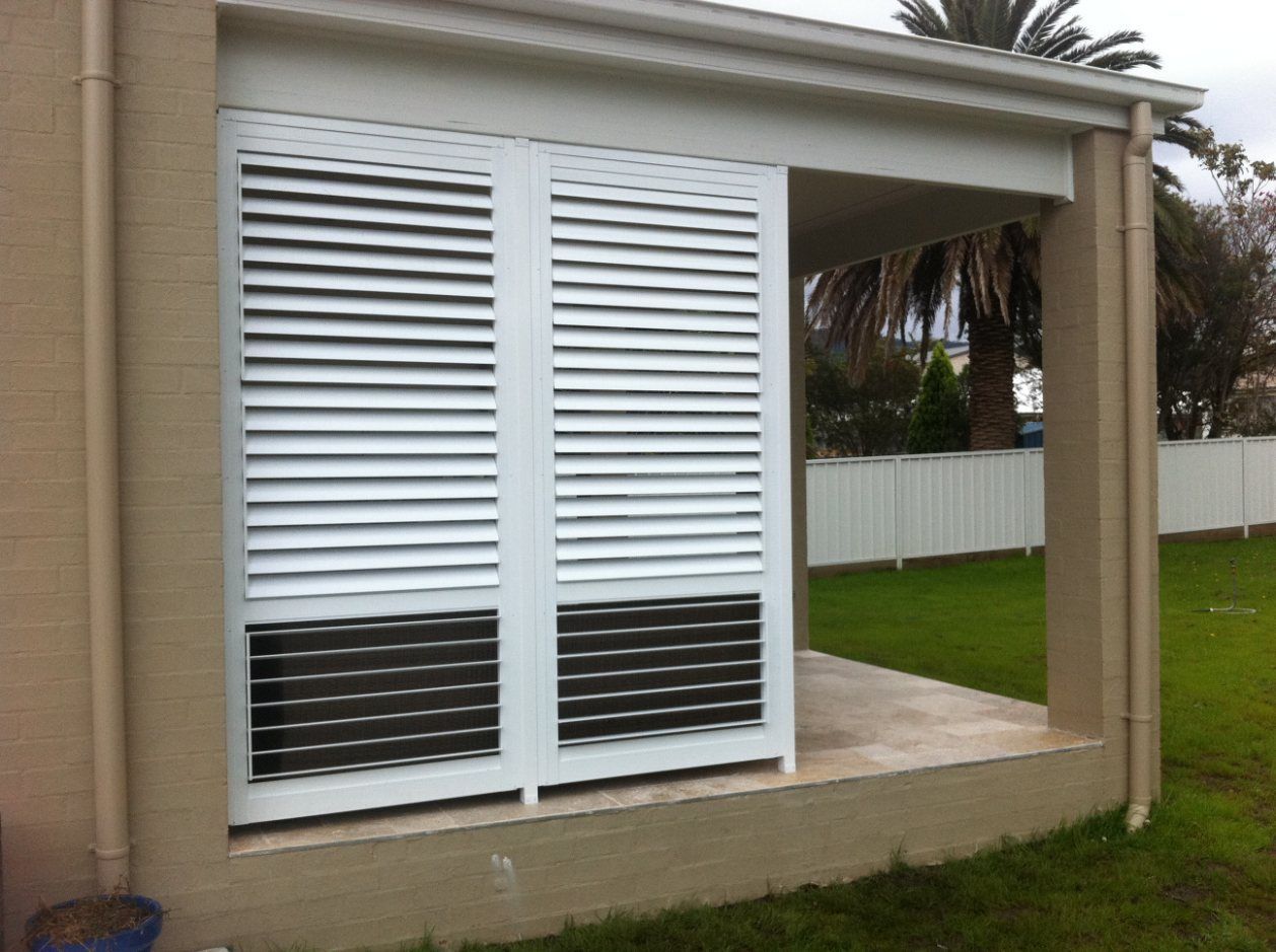 A House with A Porch and Shutters on The Windows — Lifestyle Aluminium Fabrication In Albion Park Rail, NSW