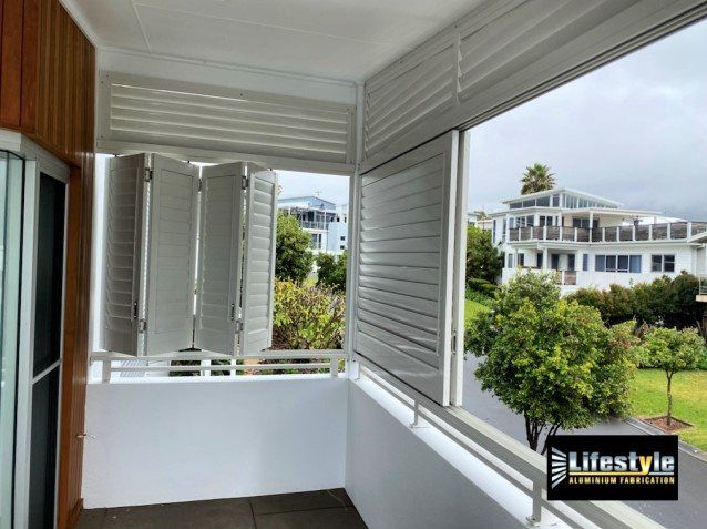A Balcony with A Fence and Blinds on It — Lifestyle Aluminium Fabrication In Albion Park Rail, NSW