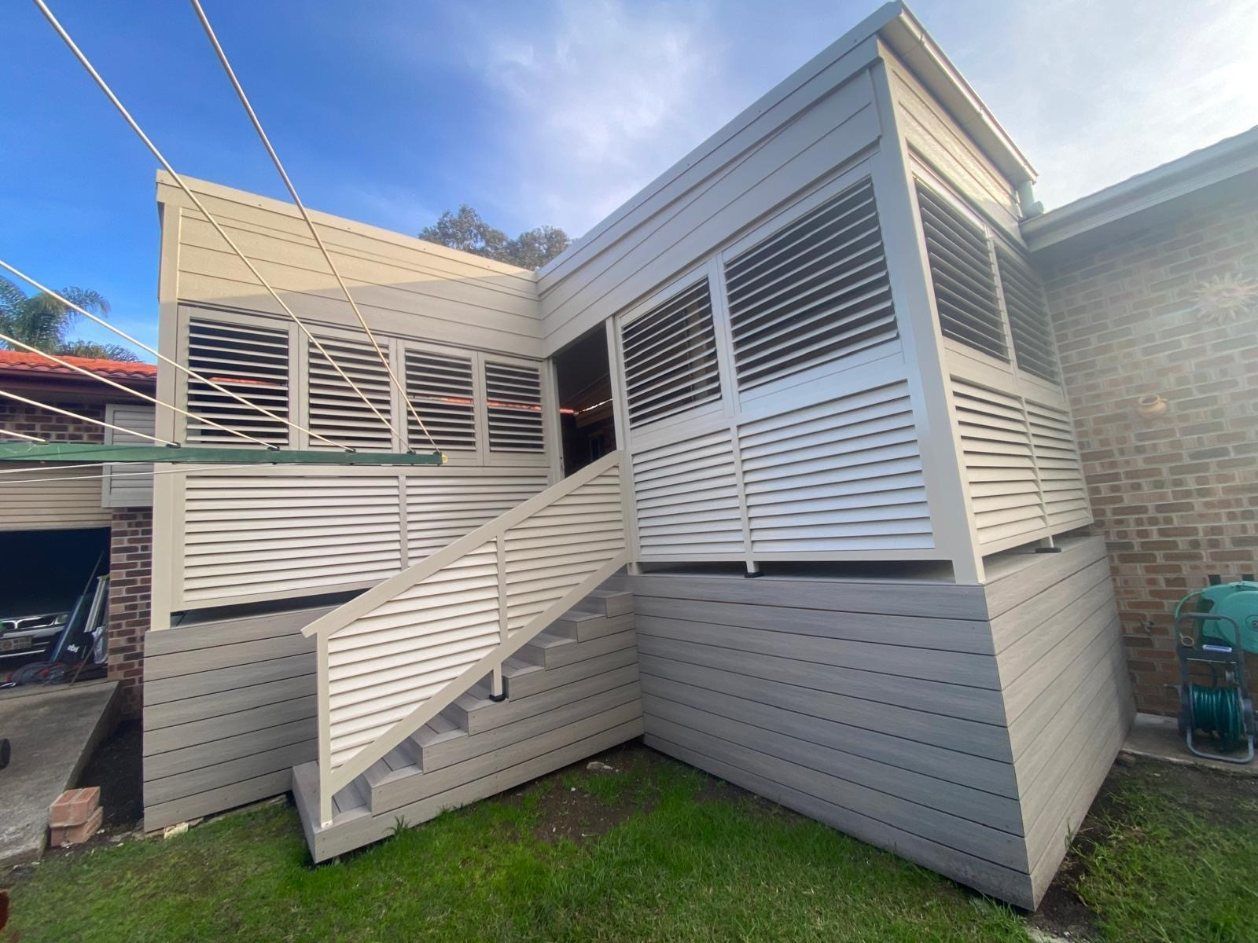 A Set of Stairs Leading up To a Door on The Side of A Building — Lifestyle Aluminium Fabrication In Albion Park Rail, NSW