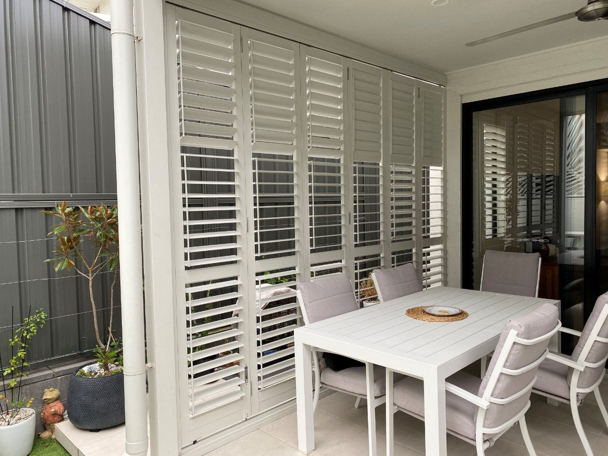 A White House with Stairs Leading up To the Second Floor — Lifestyle Aluminium Fabrication In Albion Park Rail, NSW