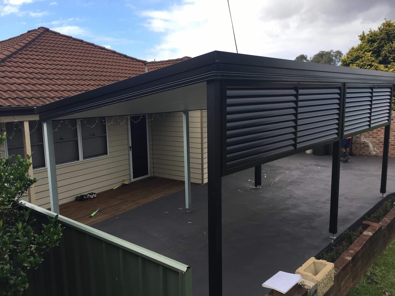 A House with A Carport and A Fence in Front of It — Lifestyle Aluminium Fabrication In Shellharbour, NSW