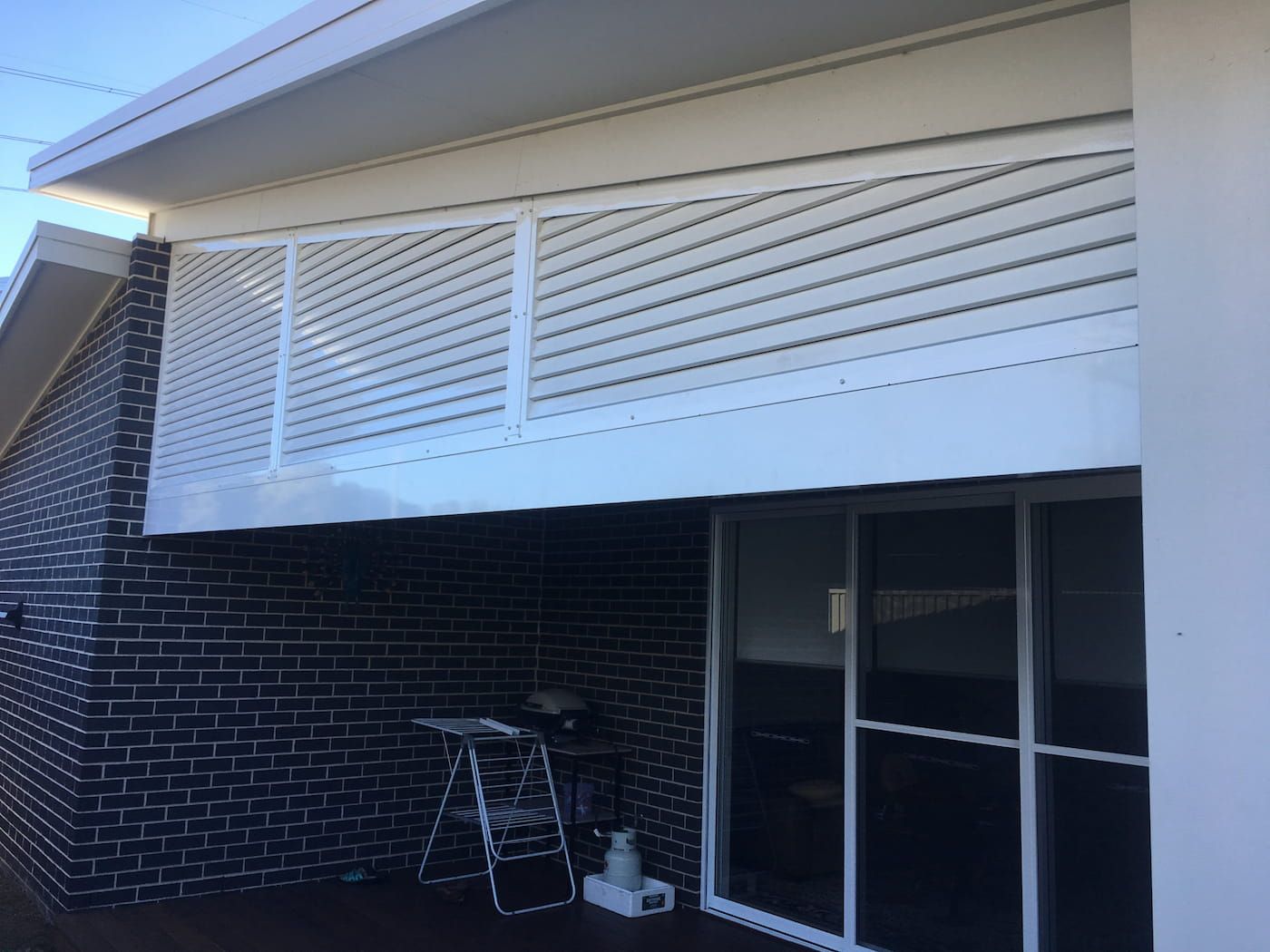 A House with A Balcony and A Sliding Glass Door — Lifestyle Aluminium Fabrication In Kiama, NSW