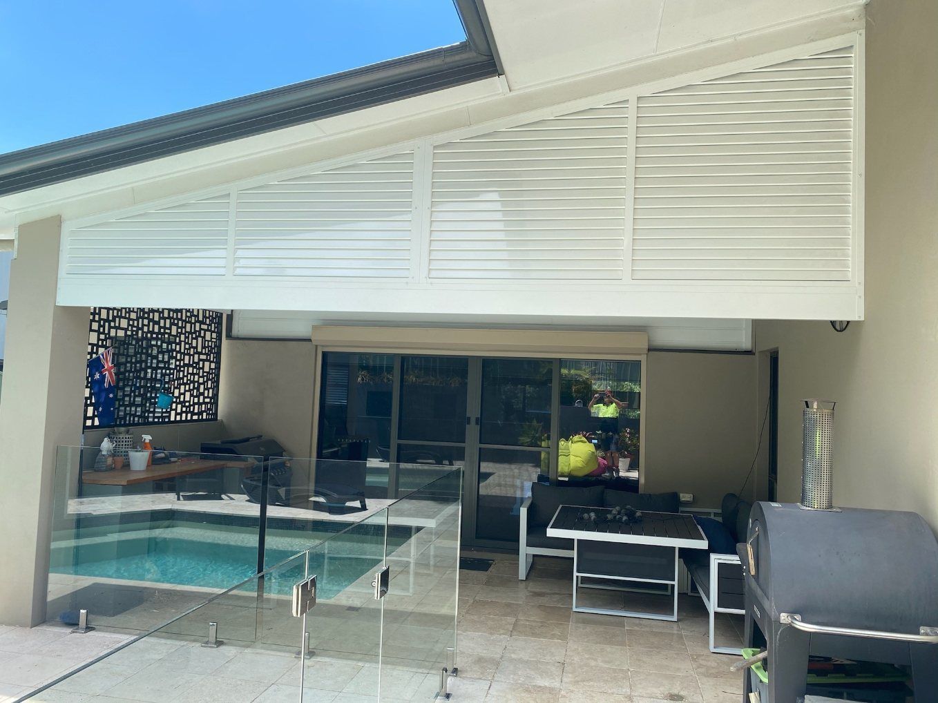 There Is a Swimming Pool in The Backyard of A House — Lifestyle Aluminium Fabrication In Albion Park Rail, NSW