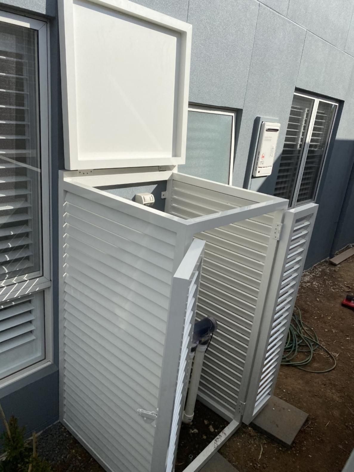 A White Box With The Lid Open Is Sitting In Front Of A Building — Lifestyle Aluminium Fabrication In Shellharbour, NSW