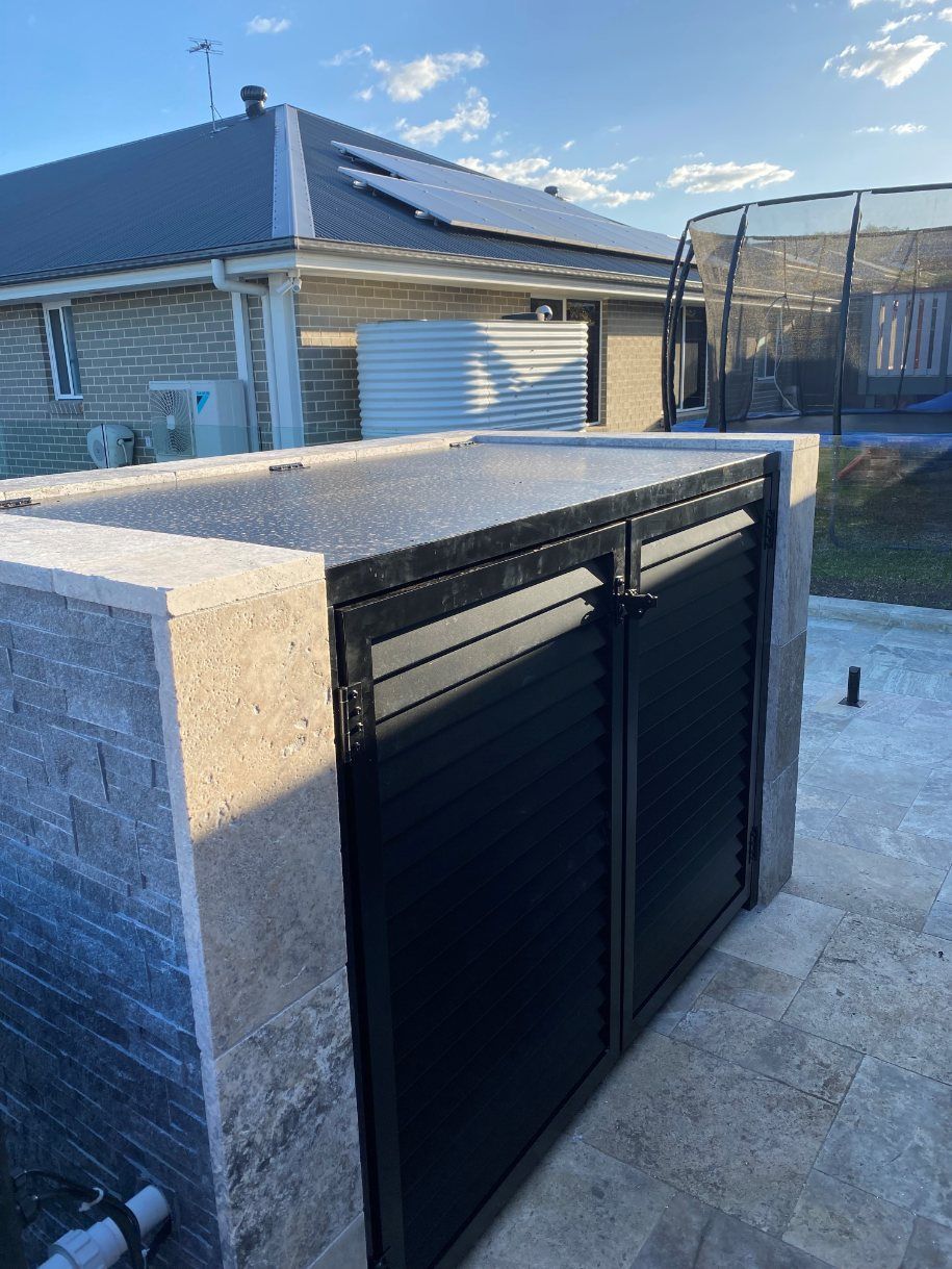 A Trash Can Is Sitting in Front of A House with A Trampoline — Lifestyle Aluminium Fabrication In Albion Park Rail, NSW