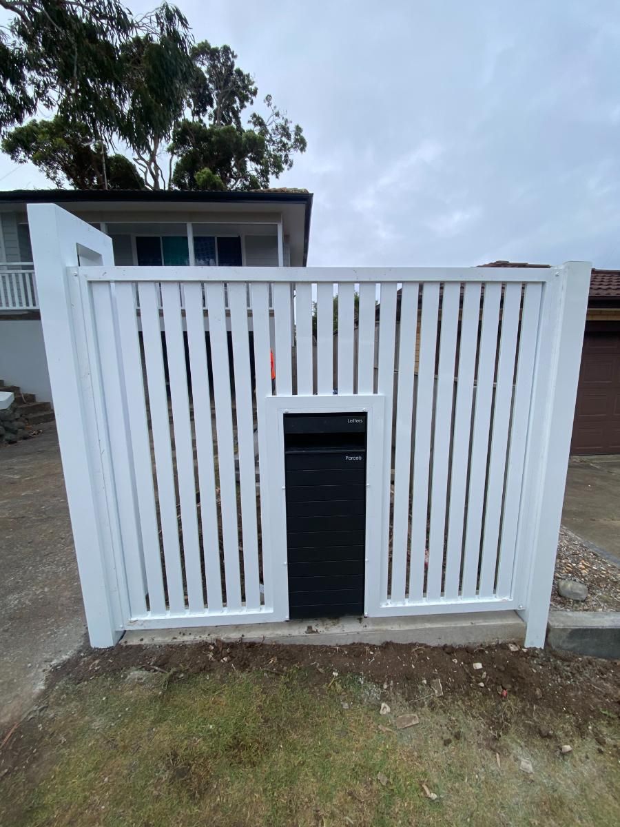 A White Fence With a Black Mailbox — Lifestyle Aluminium Fabrication In Fairy Meadow, NSW