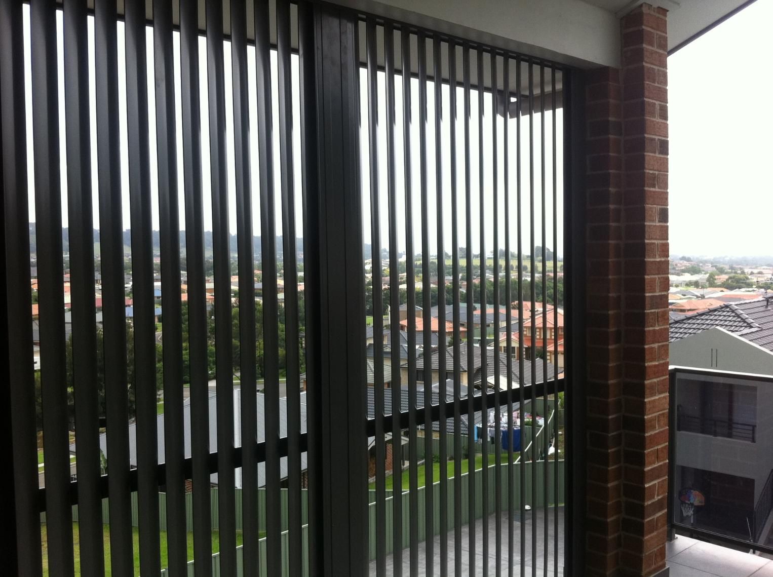 A Balcony With A Fence And A View Of A City — Lifestyle Aluminium Fabrication In Wollongong, NSW