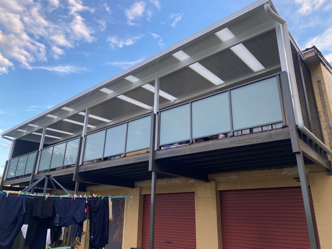 A Balcony with A View of A City and Mountains — Lifestyle Aluminium Fabrication In Albion Park Rail, NSW