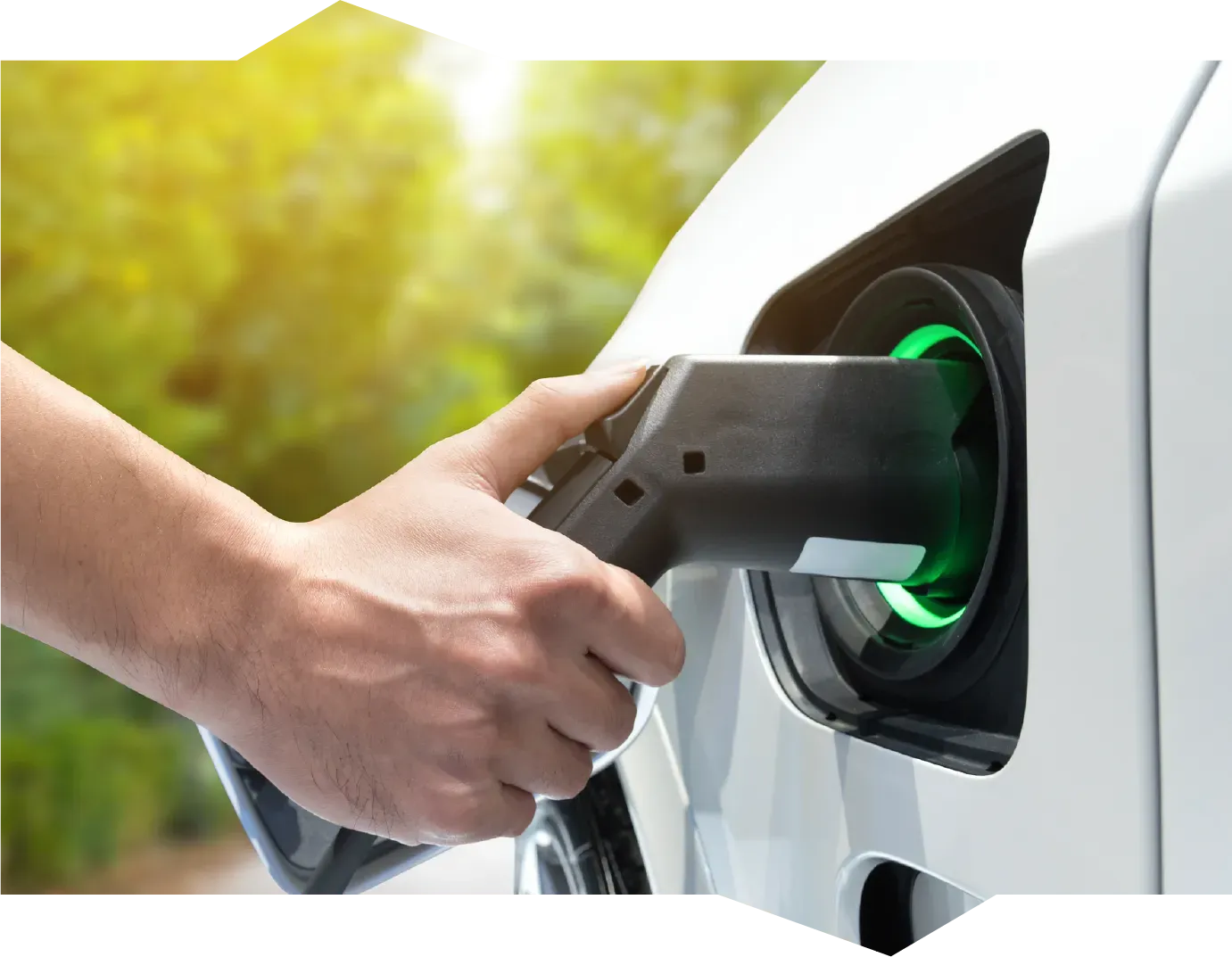 A person is opening a car door with a key.