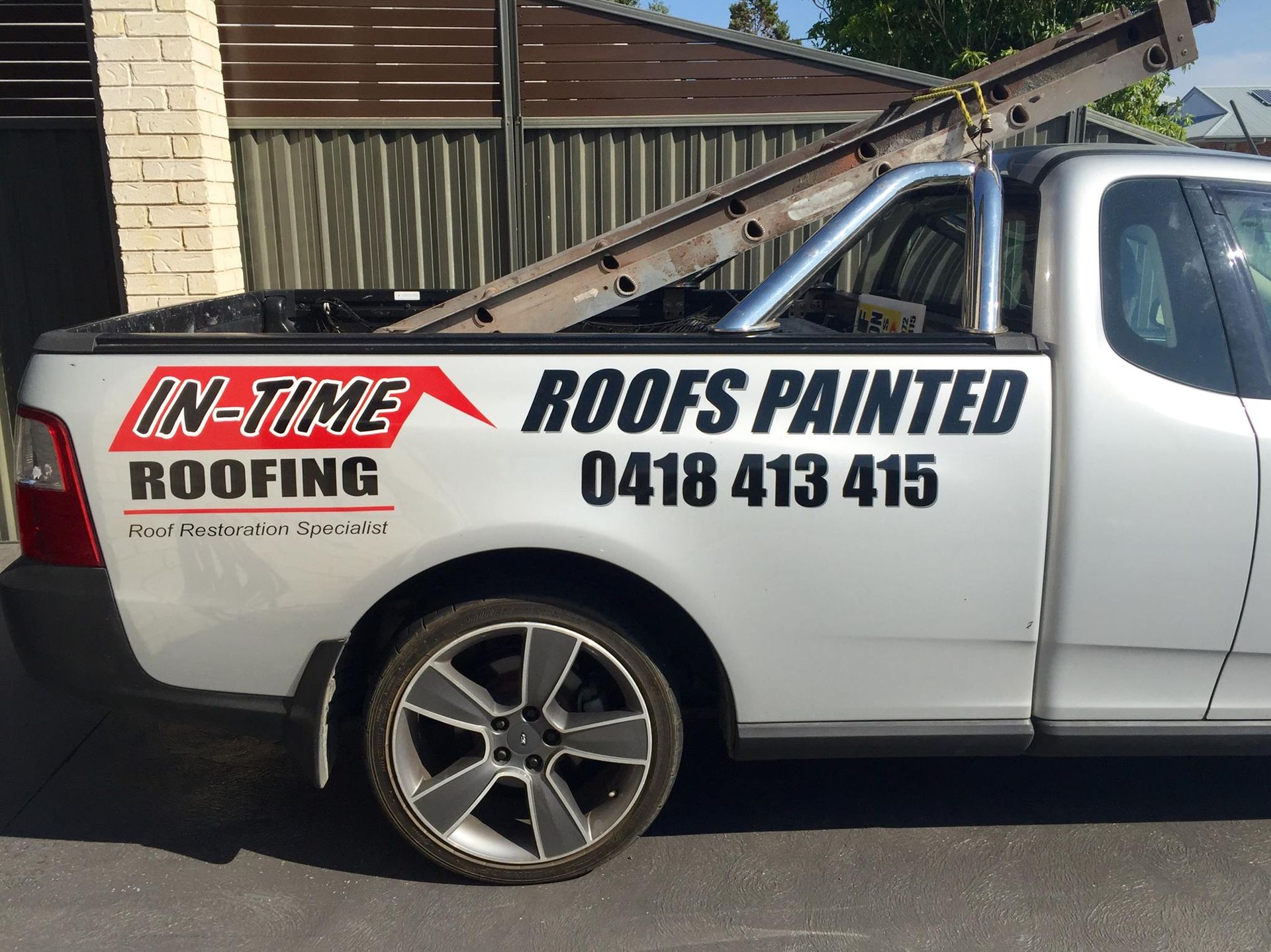 A White Truck That Says In Time Roofing On The Side — In-Time Roofing In Newcastle, NSW
