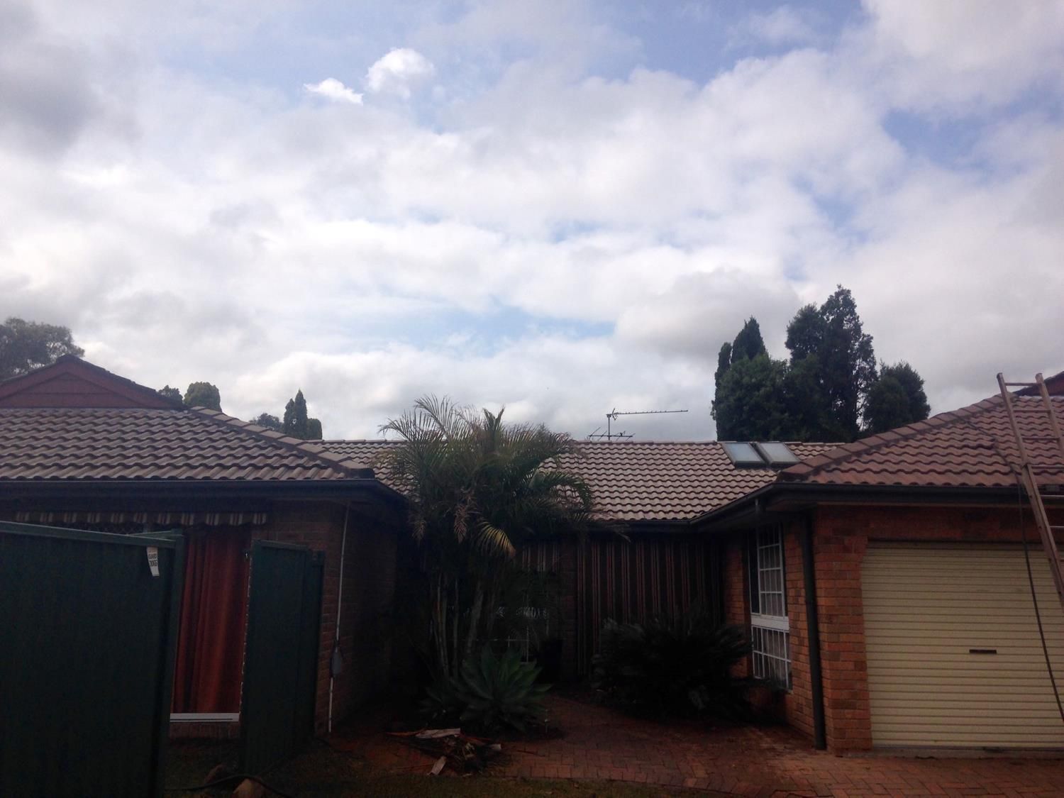 A House With A Roof That Has A Solar Panel On It — In-Time Roofing In Maitland, NSW