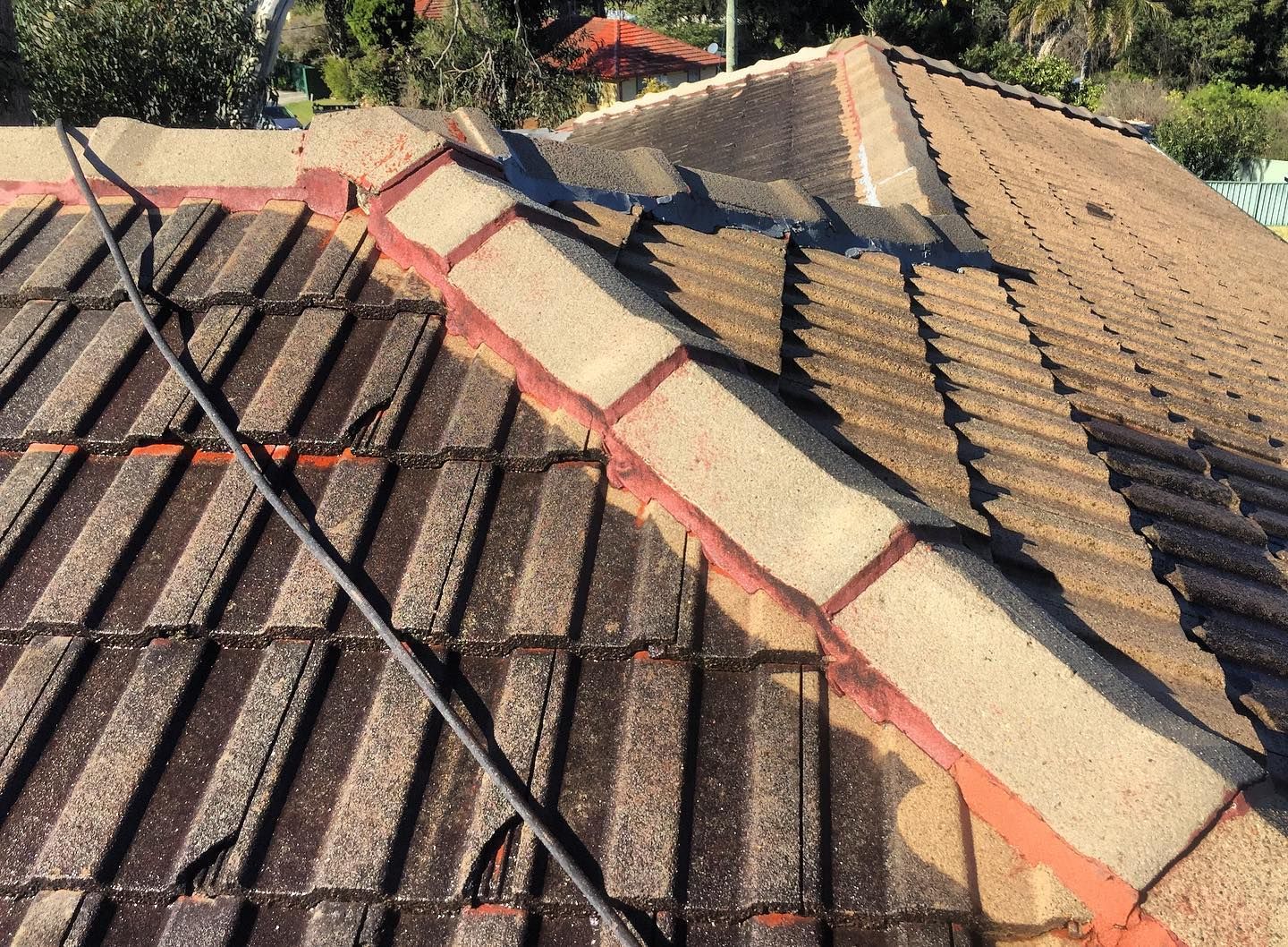 A Close Up Of A Roof With A Telephone Pole On It — In-Time Roofing In Newcastle, NSW