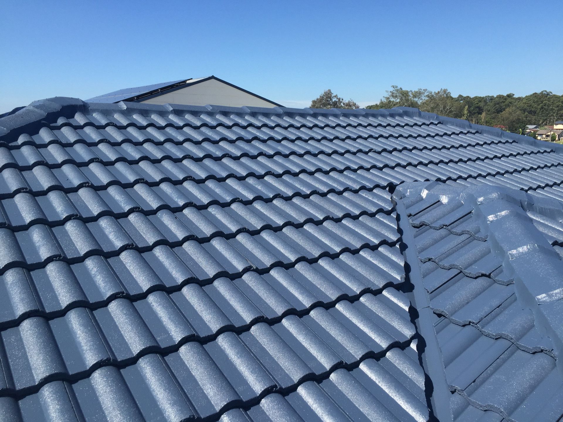 A Roof With A Lot Of Tiles On It And A Blue Sky In The Background — In-Time Roofing In Newcastle, NSW