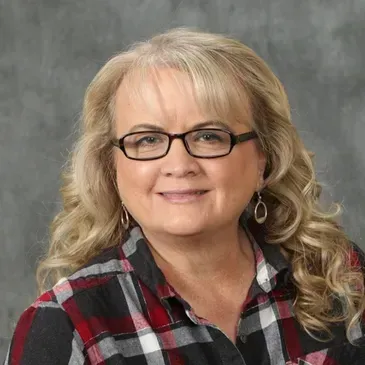 female Insurance agent with blond hair and happy disposition