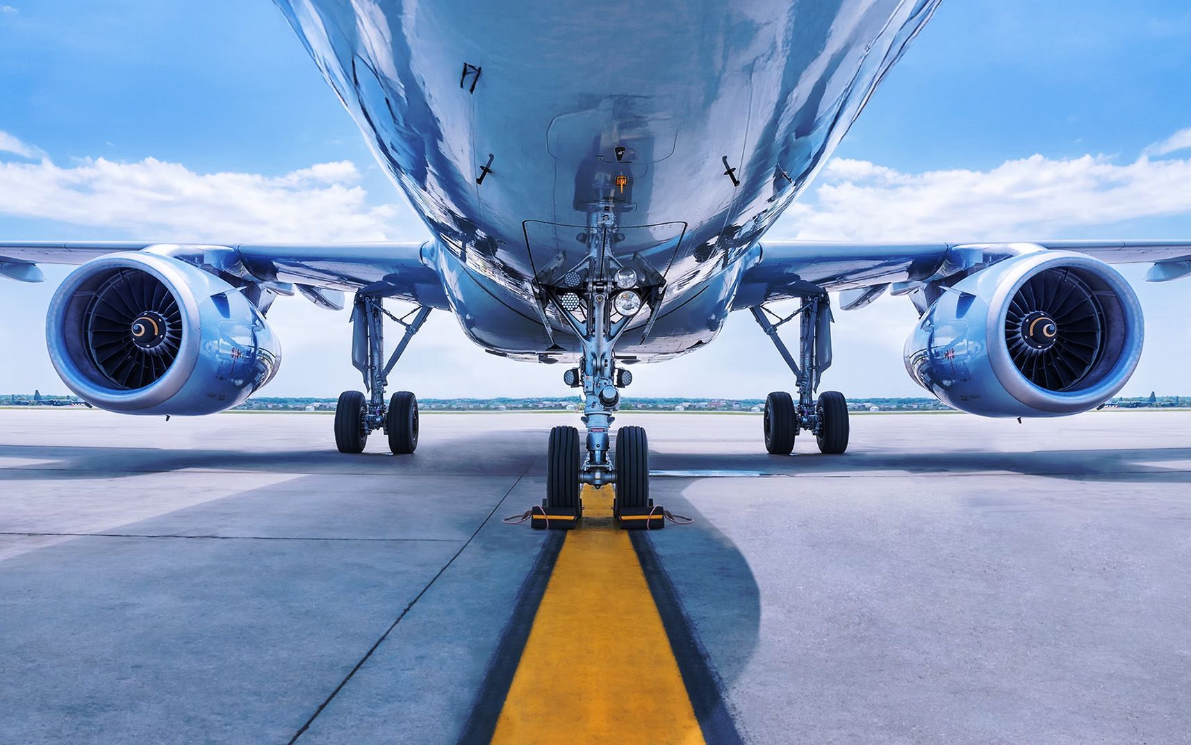 Front view of commercial airliner parked on runway for advanced training article.