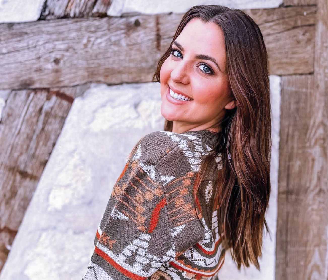 Student smiling outdoors for private pilot training testimonial.