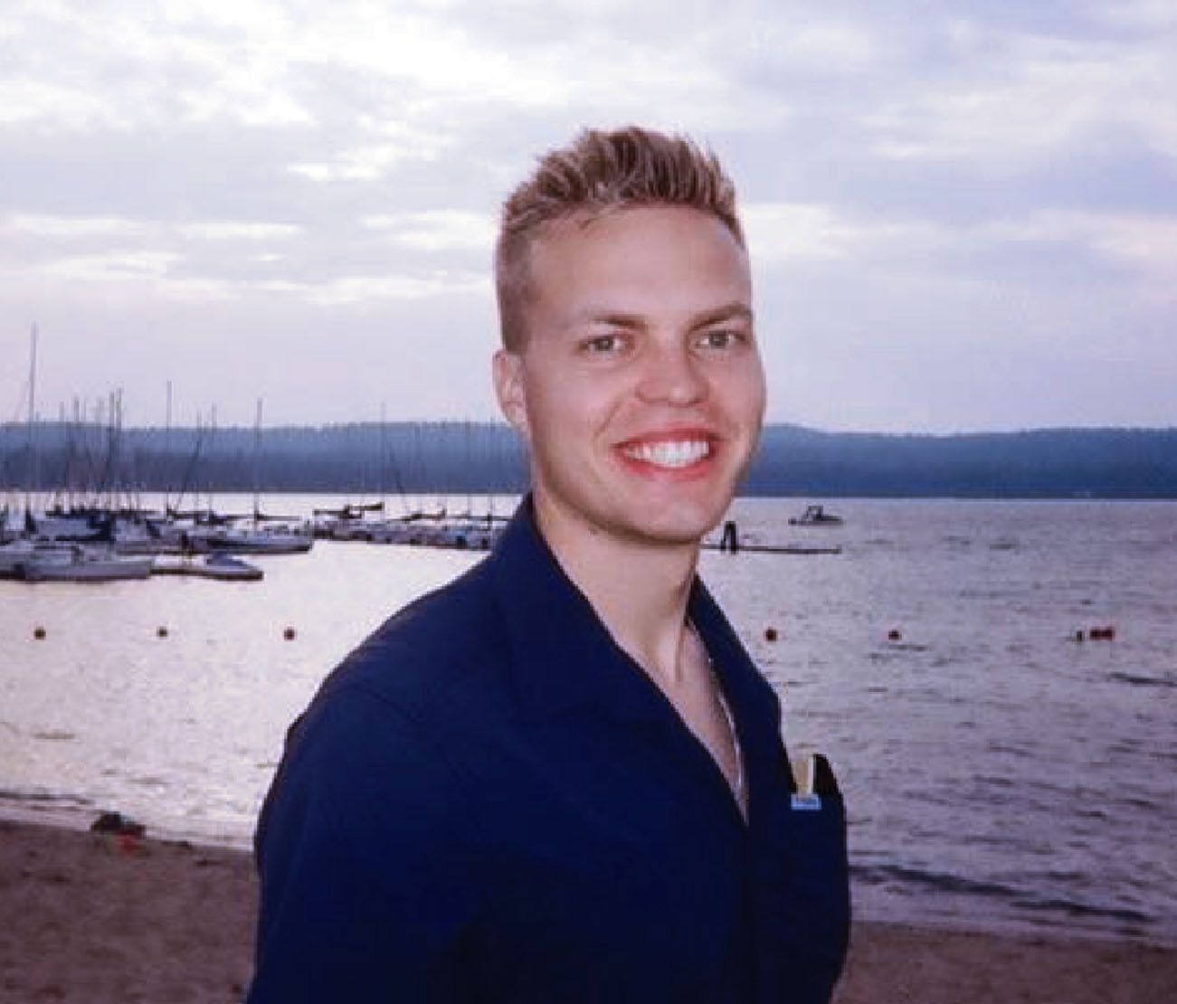 Student smiling outdoors for accelerated pilot training testimonial.