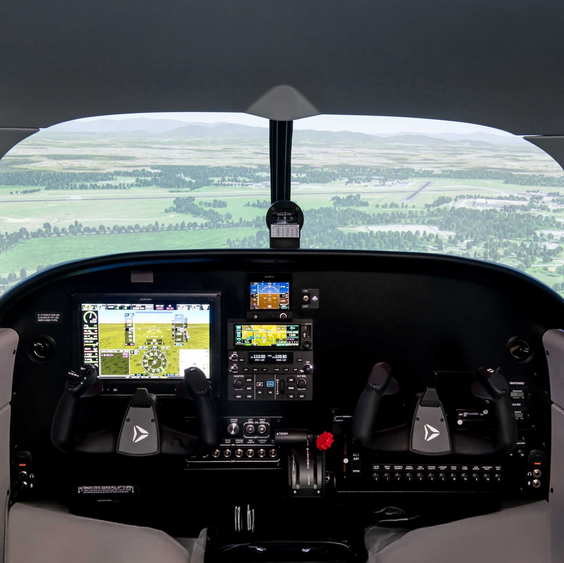 ALSIM flight simulator cockpit view showing digital flight instruments.
