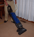 Using Vacuum To Clean A Carpet — Gallatin, TN — Master’s Touch Cleaning and Restoration