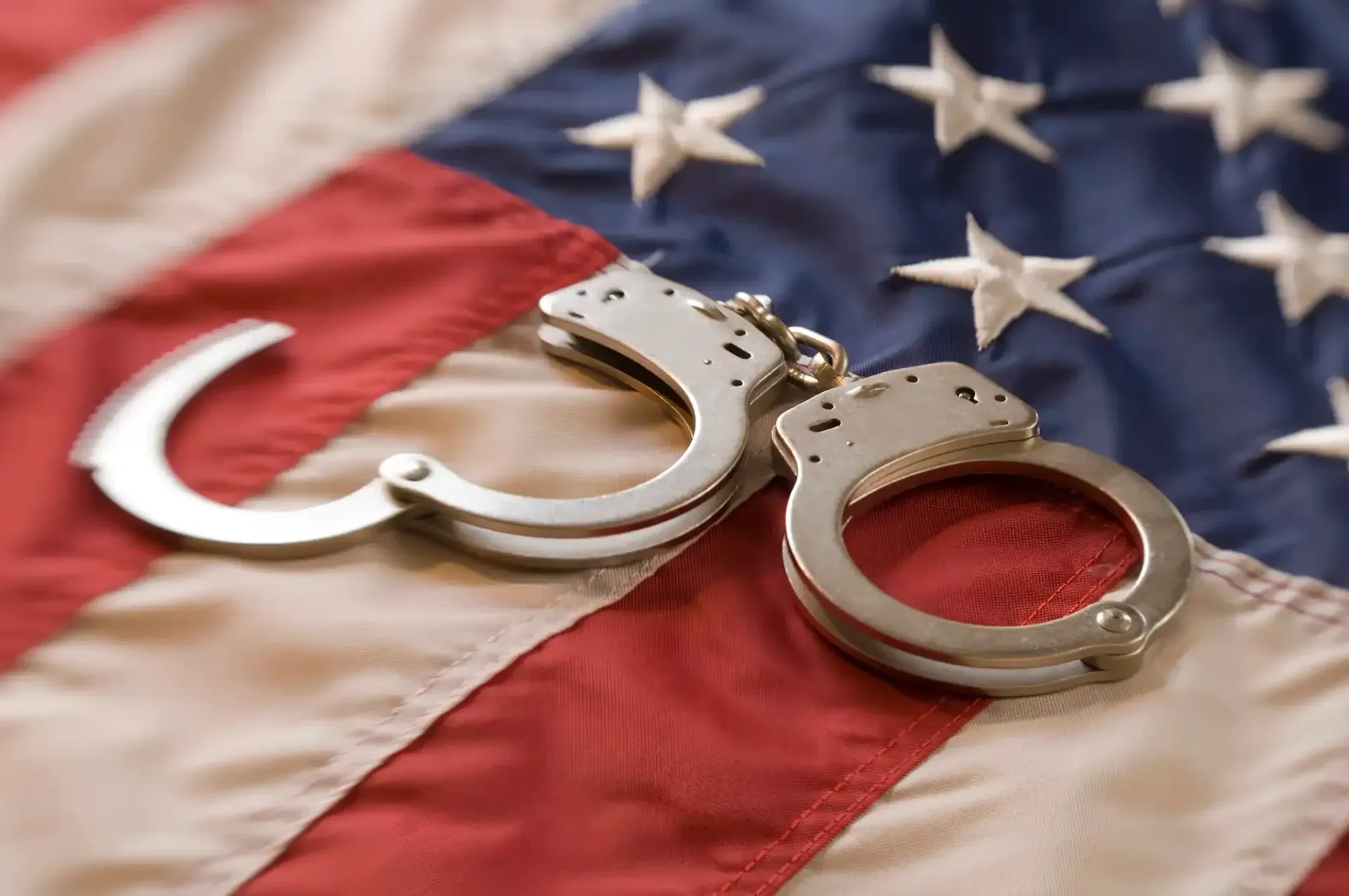 Handcuffs on a U.S. flag background