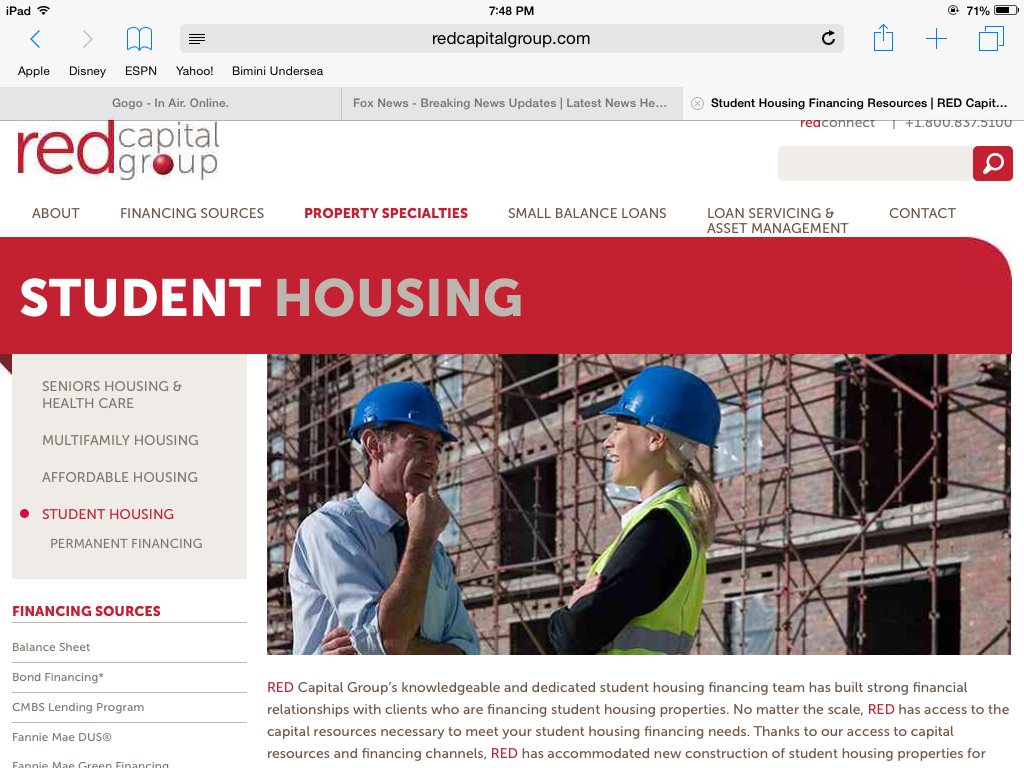 Red Capital Group website: Student Housing section with two construction workers in front of a building.