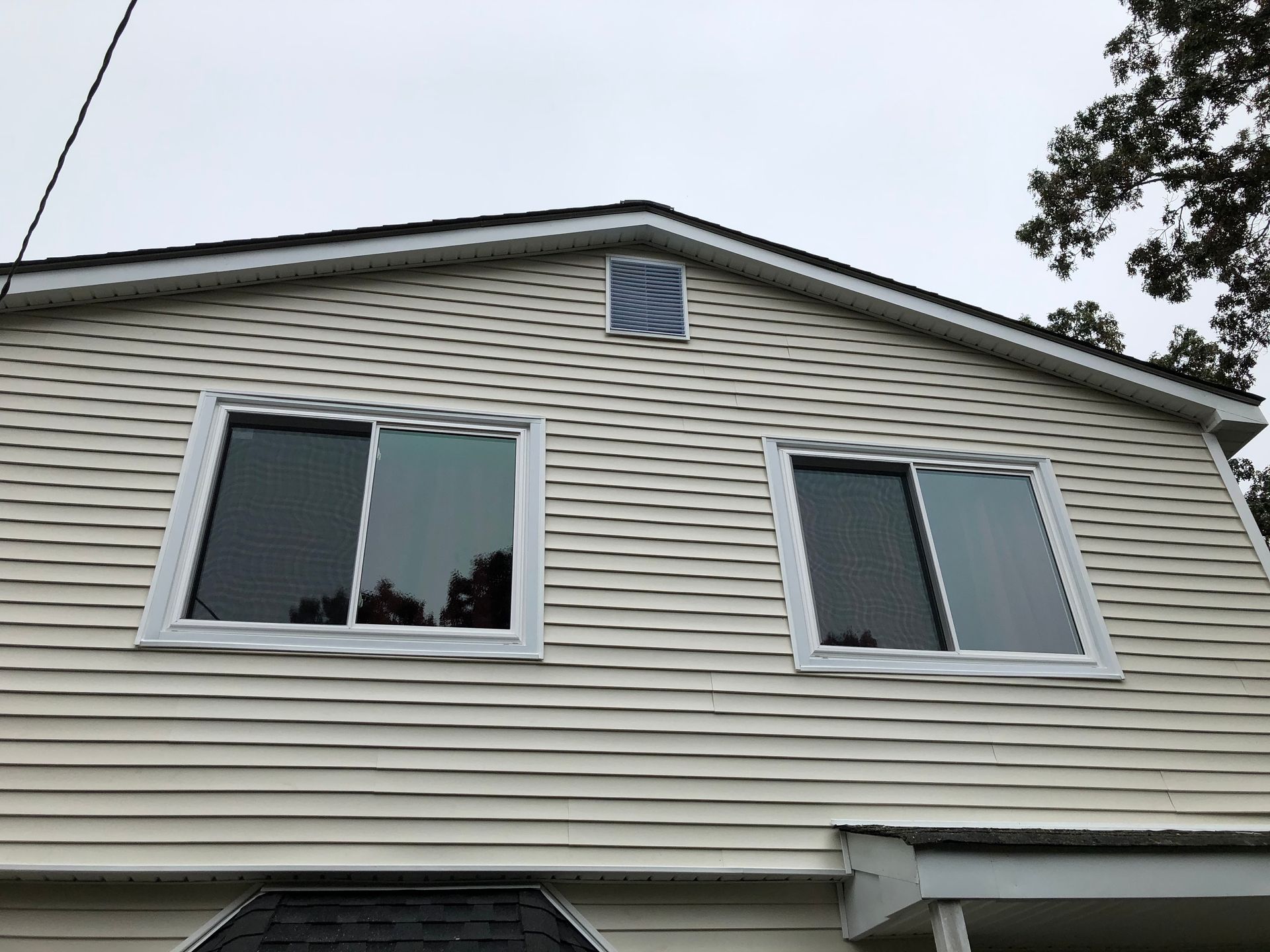 A house with a lot of windows on the side of it.