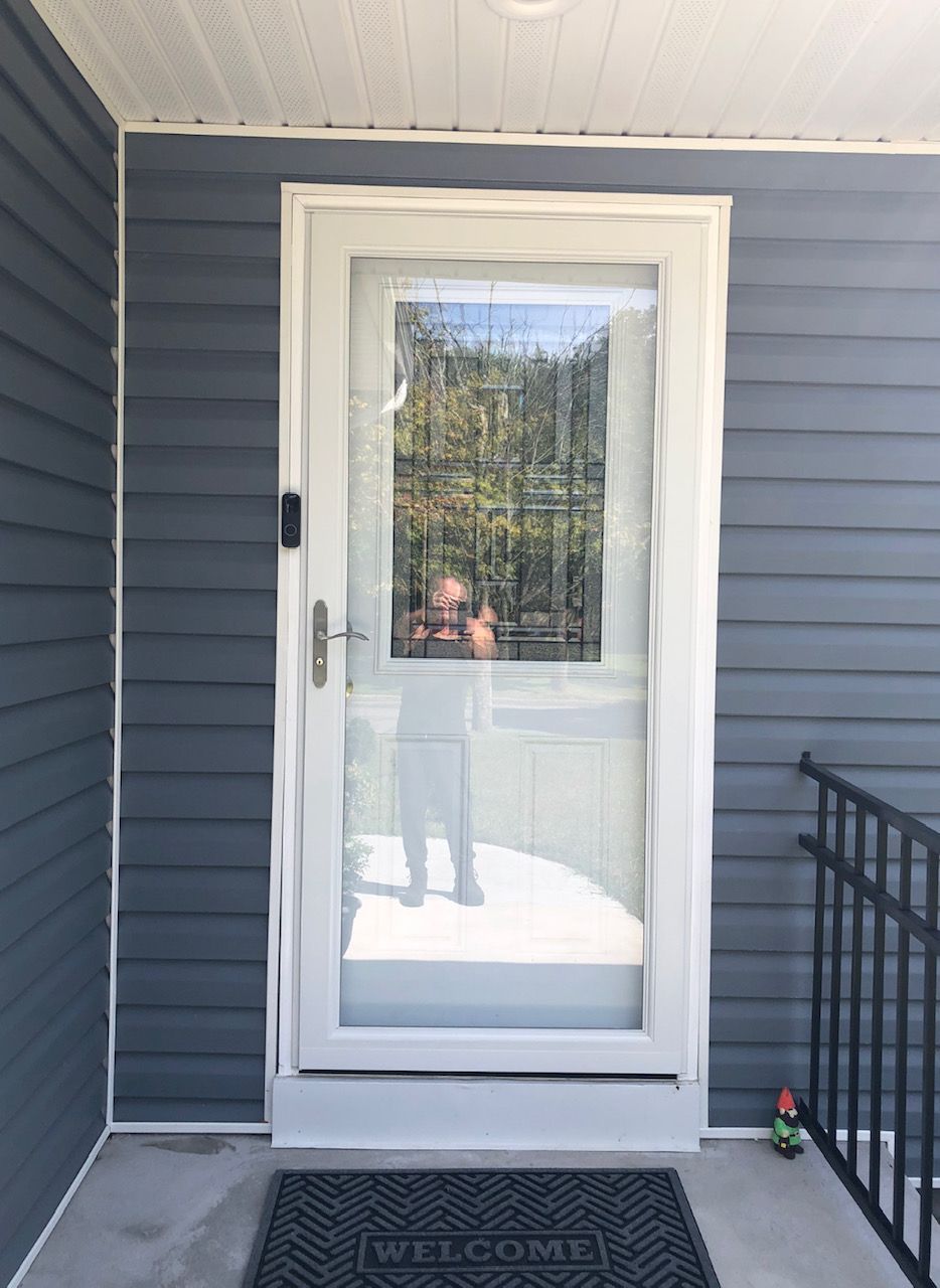 A door with a welcome mat in front of it