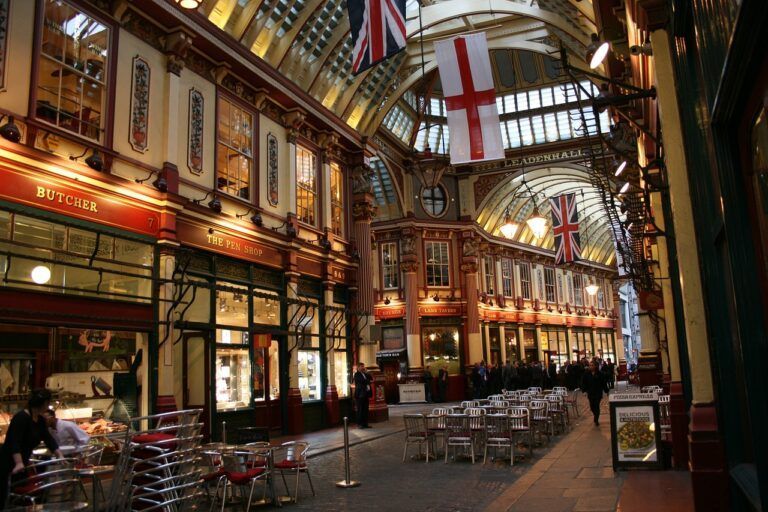 The inside of a building with british flags hanging from the ceiling