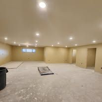 There is a trash can in the middle of the room.