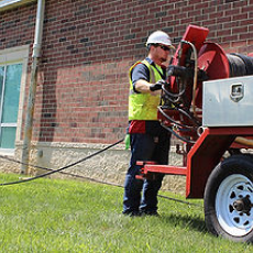 A Man Clearing Debris | Grove City, OH | CST Utilities