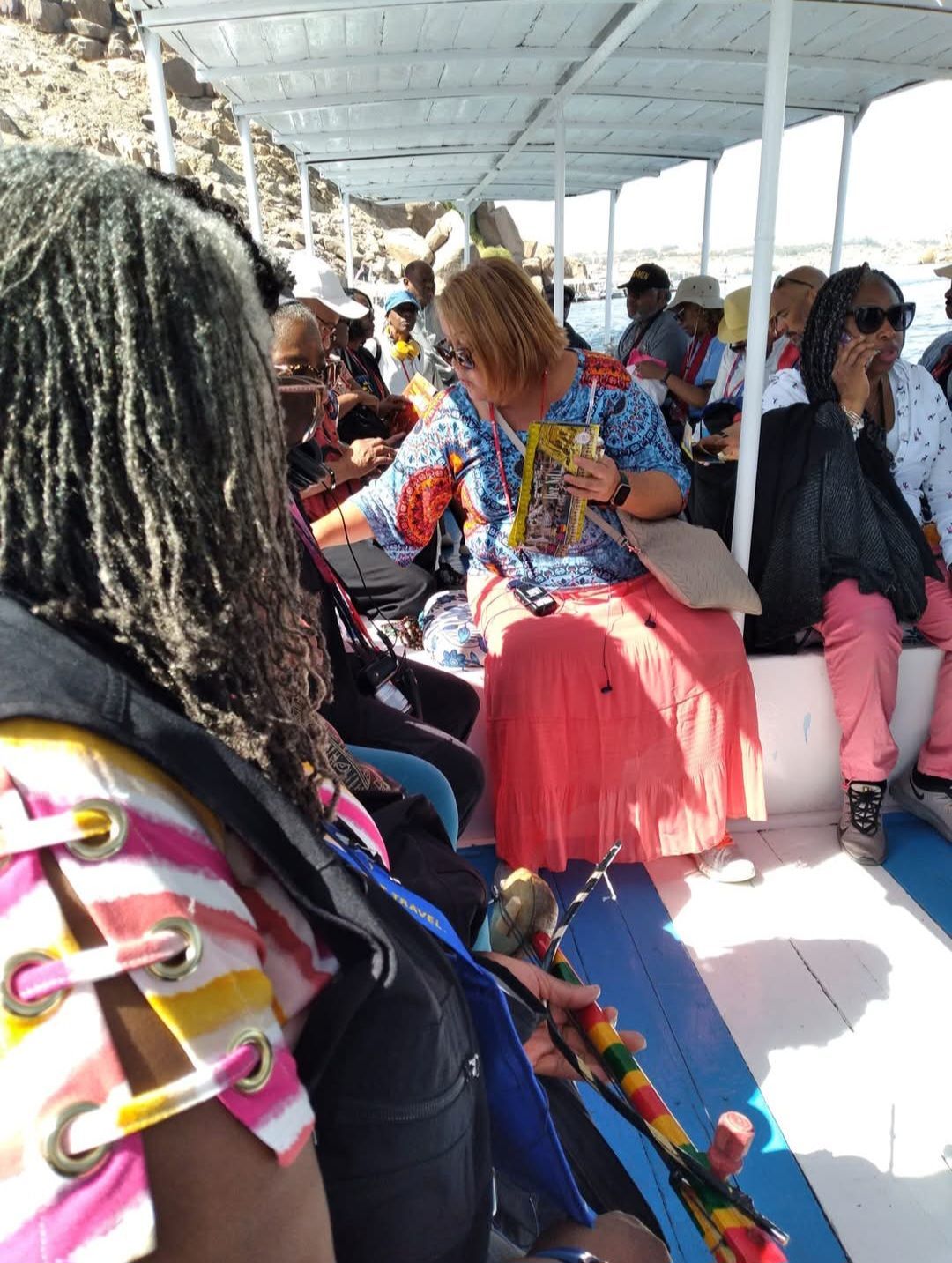 A group of people are sitting on a boat