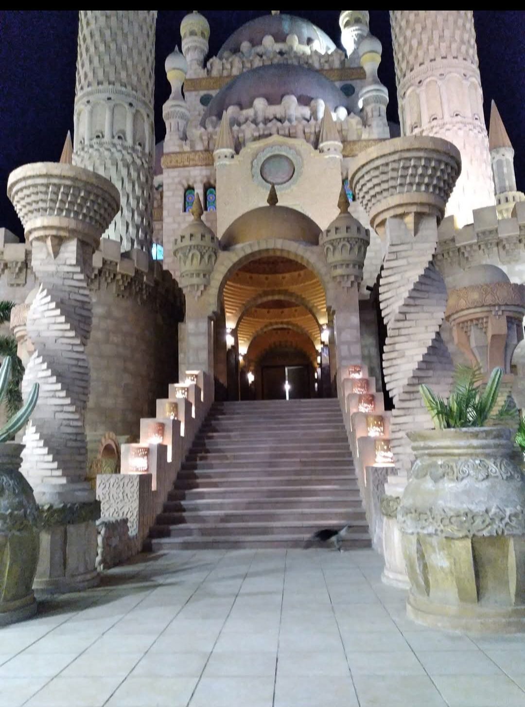 A castle shaped building with stairs leading up to it