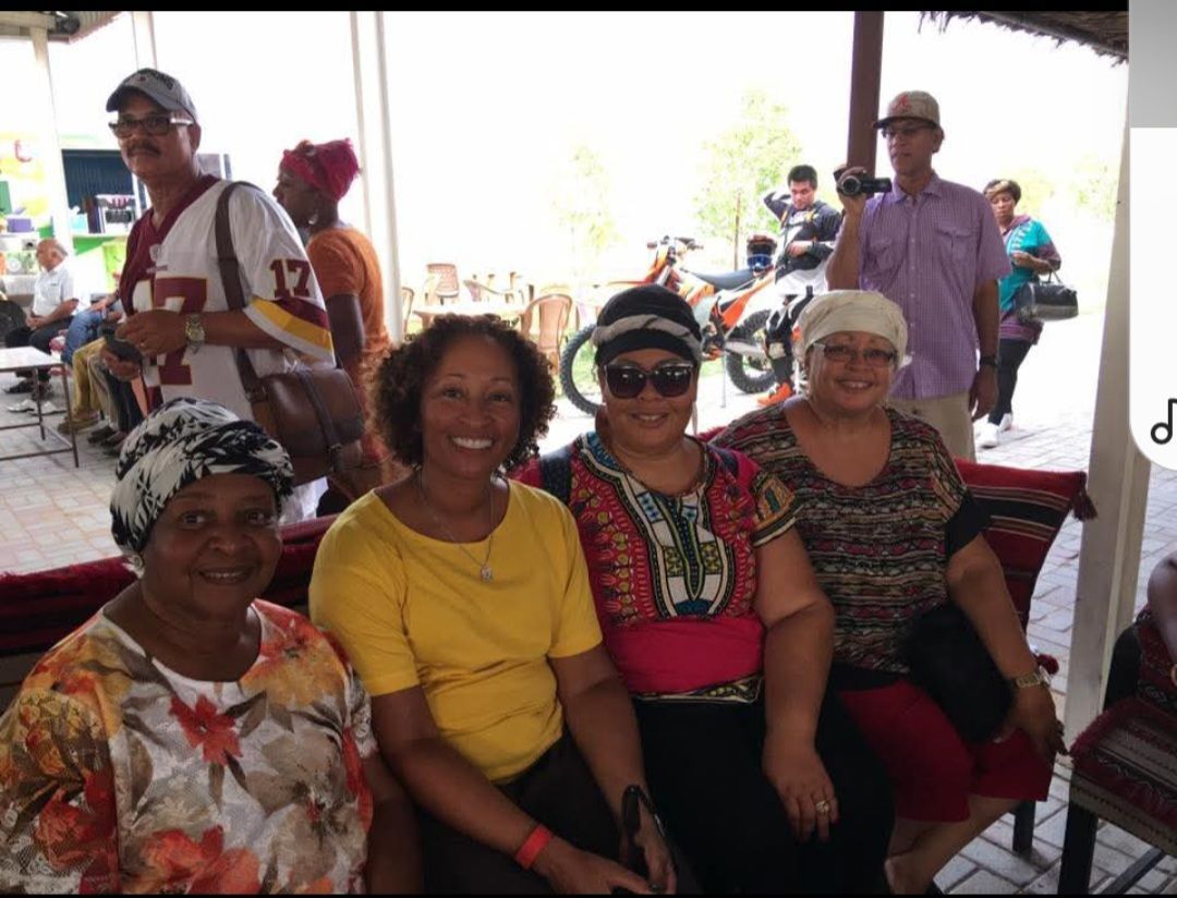 A group of people posing for a picture with one wearing a jersey with the number 17 on it