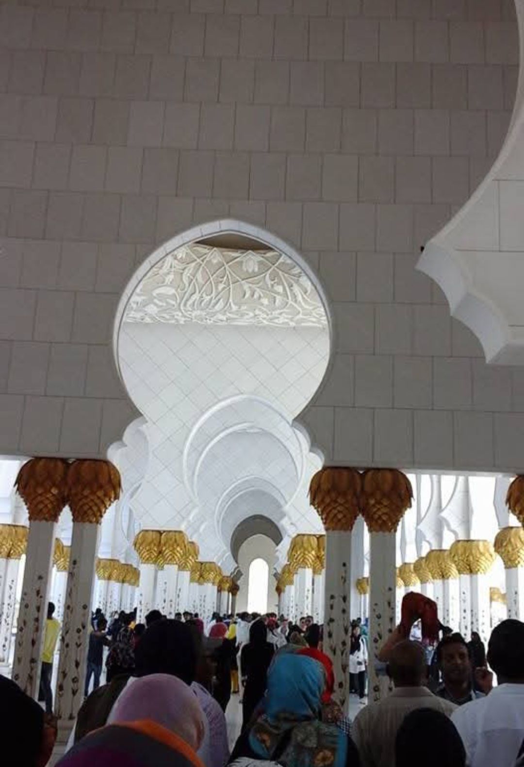 A group of people are standing inside of a building