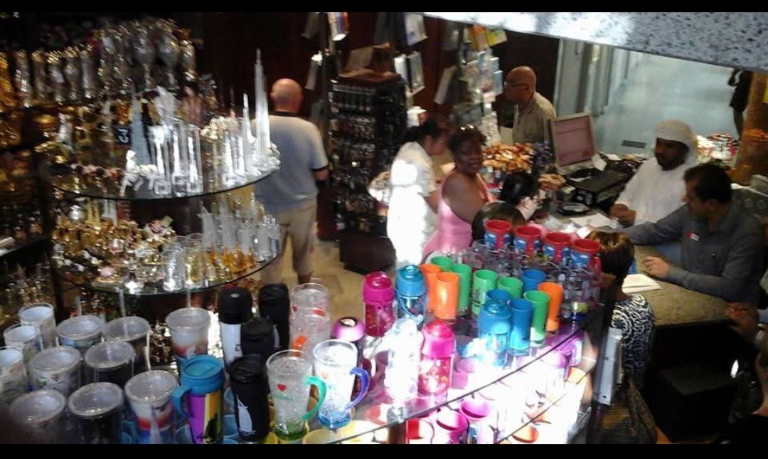 A store filled with lots of colorful cups and glasses
