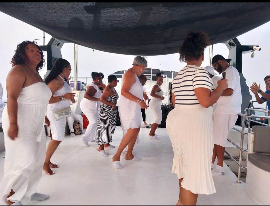 A group of women are dancing on a boat