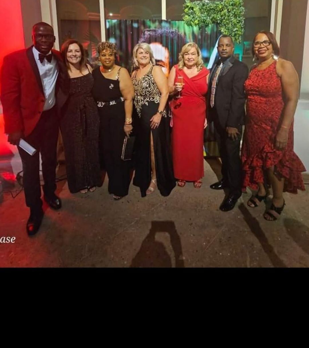 A group of people are posing for a picture together.