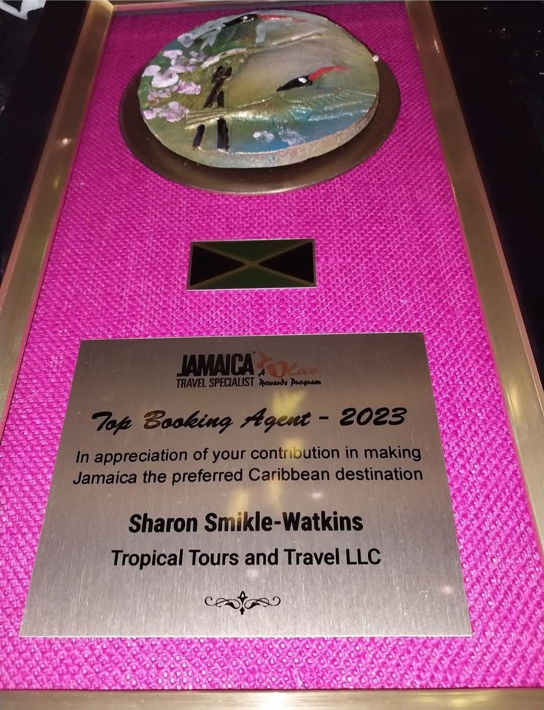A plaque for sharon smokle-watkins tropical tours and travel llc