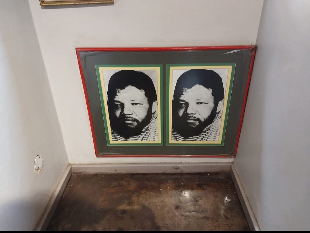 Two framed portraits of a man with a beard