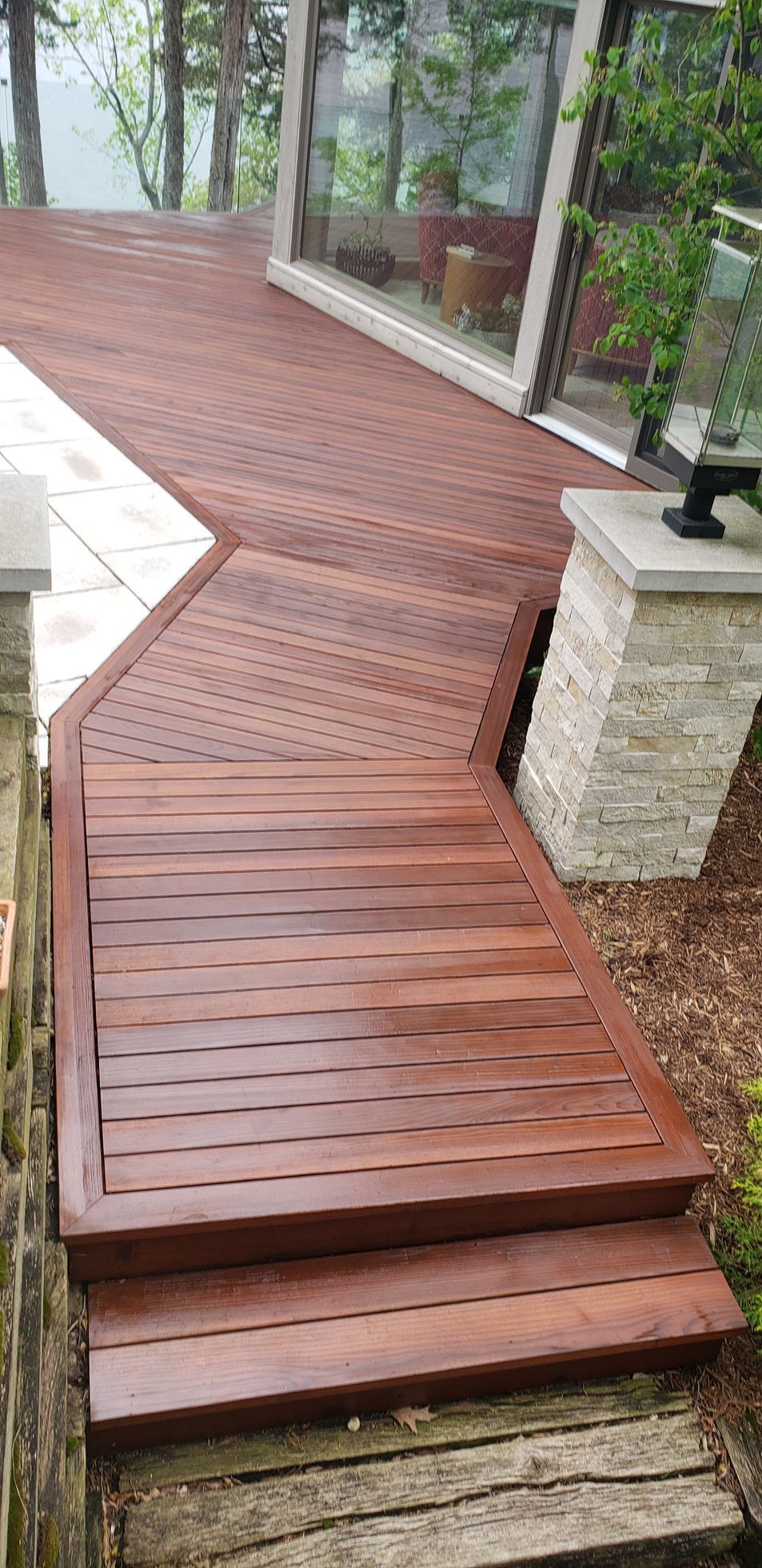A wooden deck with stairs leading up to it.
