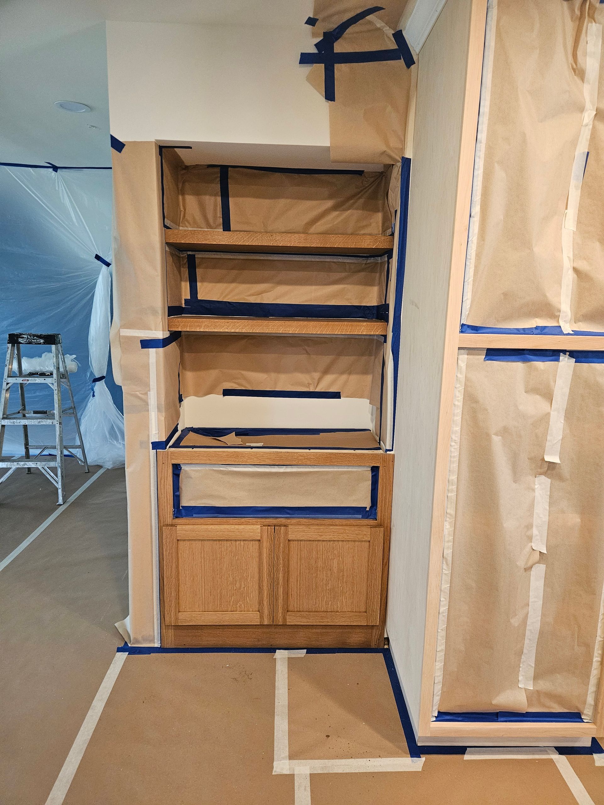 A corner of a room that is being painted