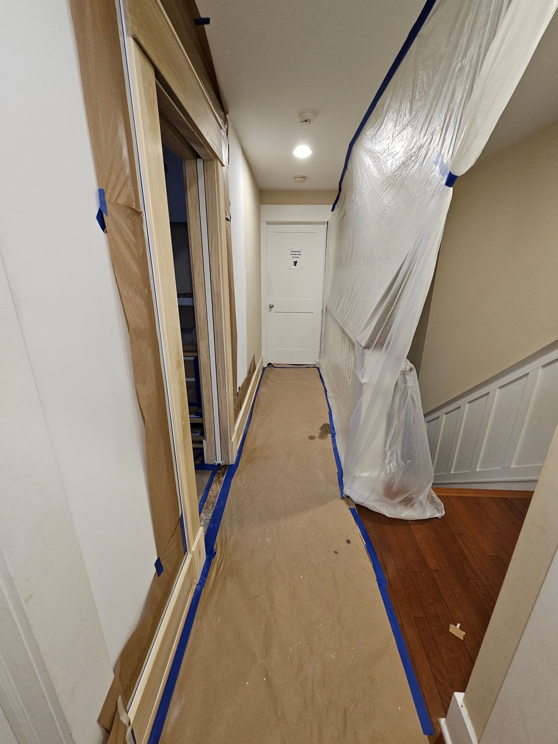 A hallway with a plastic sheet covering it