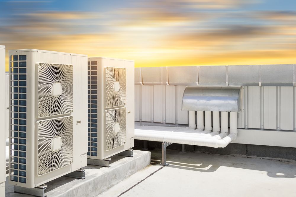 There Are Two Air Conditioners On The Roof Of A Building — East Coast Air In Cessnock, NSW