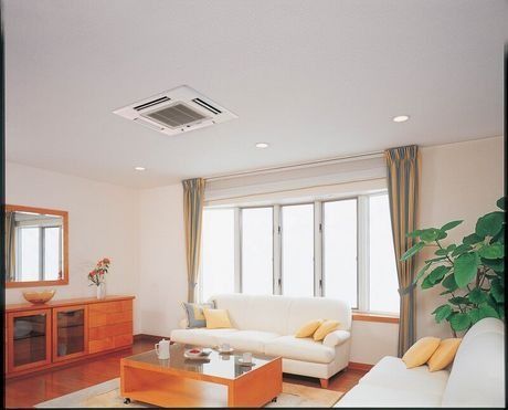 A Living Room With A Couch And A Coffee Table — East Coast Air In Cessnock, NSW