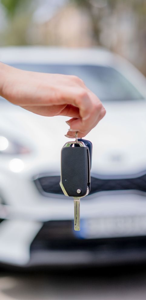 female-holding-car-key