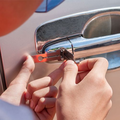 technician-unlocking-door-lock-with-a-tool