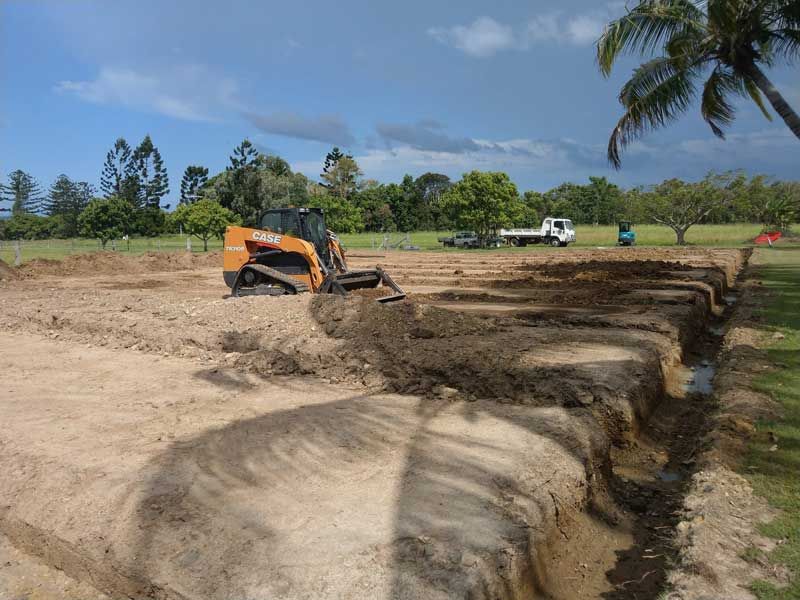 Yellow excavator digging the ground — Excavation in Alligator Creek, QLD